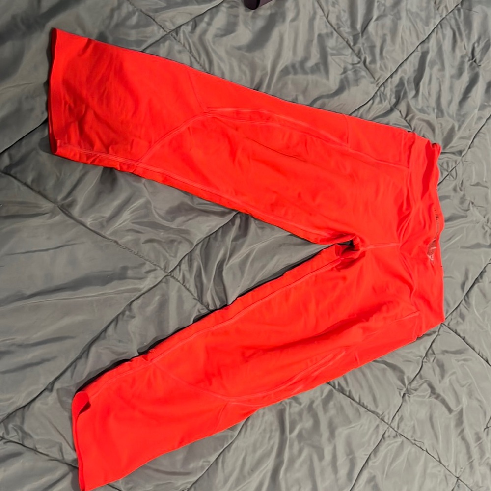 Victoria Sport red carpi leggings with pockets on both sides, size large